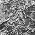Abstract crumpled silver aluminum foil closeup background texture detailed textured pattern macro closeup Royalty Free Stock Photo