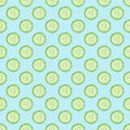 Cucumber slices pattern on sky blue background.