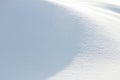 Abstract curved shadow on fresh white snow background Royalty Free Stock Photo