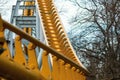 Abstract curved steel structure of yellow color