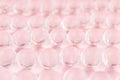 Abstract cute fresh pink background with transparent glass cells on pastel soft light backdrop, blur. Royalty Free Stock Photo