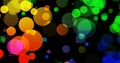 Abstract dark background with big colorful light bokeh circles. Royalty Free Stock Photo