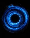 Abstract Dark Background with Glowing Blue Circular Light Trails Royalty Free Stock Photo