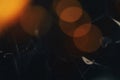 Abstract dark background with orange bokeh lights creating a moody and atmospheric feel Royalty Free Stock Photo