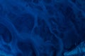 Abstract dark blue paints background liquid fluid