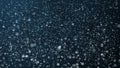 Abstract dark blue sky with blizzard snowing snowflakes.