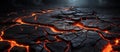 Abstract dark cracked surface with glowing, red lava flowing between the cracks on dark ominous background. The lava creates a