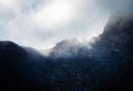 Abstract dark fog over the mountain saddle