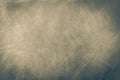 Abstract dark gray beige background with scuffs, fading, scratches and highlights