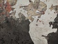 Abstract Dark Grunge wall texture background. Paint cracking off dark wall with rust underneath.distressed crackled texture. Royalty Free Stock Photo