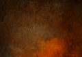 Abstract dark orange brown background darker in the border, old copper brown warm colors paper, autumn or fall background Royalty Free Stock Photo