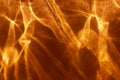 Abstract dark orange fire like background with shadows and sparkles. Royalty Free Stock Photo