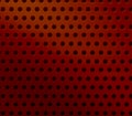 Abstract dark red perforated plastic background. Royalty Free Stock Photo