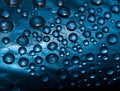 Abstract deep blue background of drops and droplets. Close up. Royalty Free Stock Photo