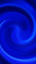 Abstract deep blue swirl of glowing energy lines creating a smooth flowing vortex Royalty Free Stock Photo