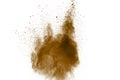 Abstract deep brown dust explosion on white background. Freeze motion of coffee liked color dust splash