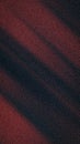 Abstract deep crimson, maroon, and black gradient background with heavy grainy noise texture, soft blur, and dynamic diagonal Royalty Free Stock Photo