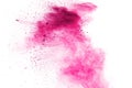 Abstract deep pink powder explosion on white background. Freeze motion of deep pink powder splash Royalty Free Stock Photo