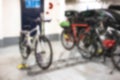 Abstract defocused bicycles locked in bike racks