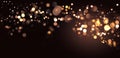 Abstract defocused golden bokeh sparkle glitter lights background. Royalty Free Stock Photo