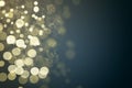 Abstract defocused golden gold glitter bokeh lights on gradient blue background. Holiday Golden confetti. Royalty Free Stock Photo