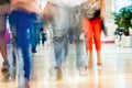 Abstract defocused motion blurred young people walking in the shopping center, urban lifestyle concept, background. Royalty Free Stock Photo