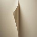 Abstract depiction of a beige-colored paper with a curved fold creating a smooth, Royalty Free Stock Photo