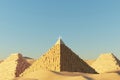 Abstract Desert Dune cliff sand with Egyptian Pyramid and clean blue sky. Surreal minimal Desert natural landscape background.