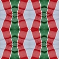 abstract design with cuts of fabric in green, white and red color, background and texture