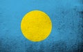 The Republic of Palau National flag. Grunge background