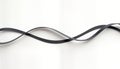 Abstract design graphic elements with black curved ribbons against white background. Soft gradient shadows create realistic 3D