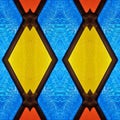 abstract design with stained glass in red, blue and yellow colors, material for decoration of windows, background and texture Royalty Free Stock Photo