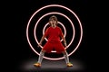 Abstract desing, concept of sport, action, motion in sport. Young little sportsman, football player in neon light on