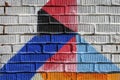 Abstract detail of brick wall with fragment of blue, red graffiti. Urban Art close-up, for backdrop use.