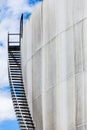 Abstract detail of a high and long stair case of an oil refinery Royalty Free Stock Photo