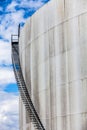 Abstract detail of a high and long stair case of an oil refinery Royalty Free Stock Photo