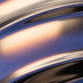 Abstract digital artwork featuring smooth wavy lines with a metallic appearanc Royalty Free Stock Photo