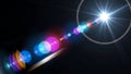 Bright star-like light source emitting vibrant and colorful lens flares on a dark background Royalty Free Stock Photo