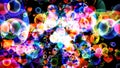 Abstract dimension rainbow bubbles with hearts floating on black screen