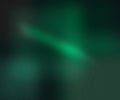 An Abstract Display of Emerald Green Gradient with Noise Texture and Light Streaks Across Dark Background Royalty Free Stock Photo