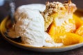 Abstract of Drop Biscuit Peach Cobbler with Ice Cream