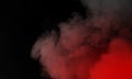 Abstract Dry ice red smoke clouds fog floor texture. Perfect spotlight mist effect on isolated black background. Royalty Free Stock Photo