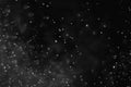 Abstract dust particles on dark background