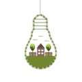 Abstract Eco Light Bulbs, Made Of Flowers With Wooden House And Trees. Efficient Energy Use Royalty Free Stock Photo