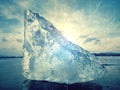 Abstract. Winter view of the frozen sea to the opposite bank. The sun in ice colorful glare Royalty Free Stock Photo