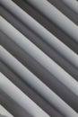 Abstract. Embossed paper white Background, light and shadow. Pattern texture repeating monochrome halftone. Stripes on White backg