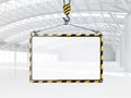 Abstract empty white warehouse interior with empty frame hanging on the crane hook Royalty Free Stock Photo