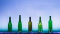 Abstract empty wine bottles with blue led illumination Royalty Free Stock Photo