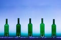 Abstract empty wine bottles with blue led illumination Royalty Free Stock Photo