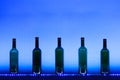 Abstract empty wine bottles with blue led illumination Royalty Free Stock Photo